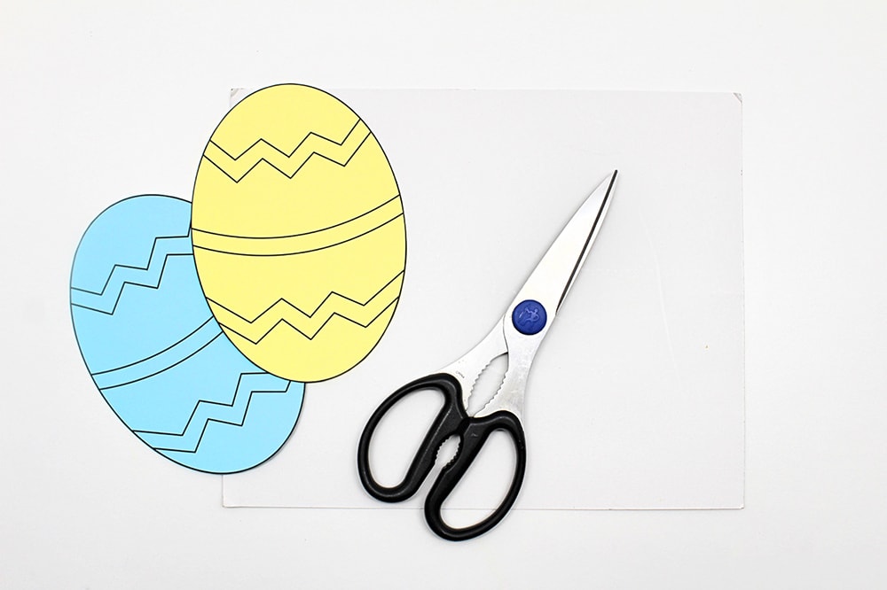 Printed Easter eggs with scissors.