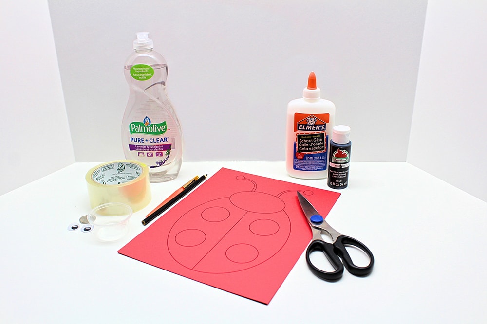 Supplies needed to make a scratch-off ladybug card.