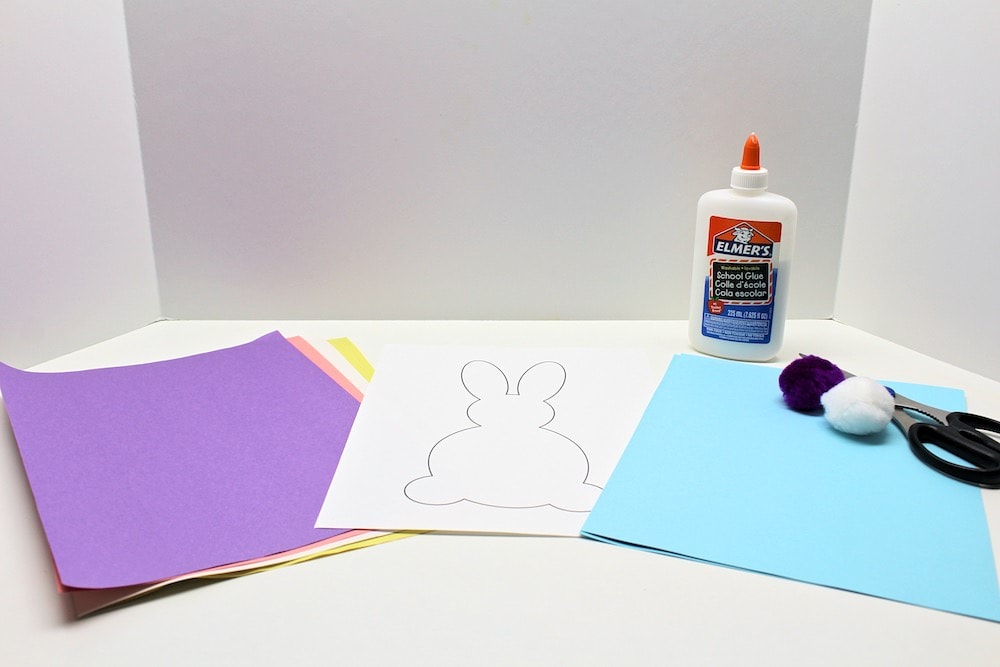 Supplies to make a torn paper strip easter bunny.