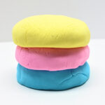 Stack of 3 balls of cloud dough.
