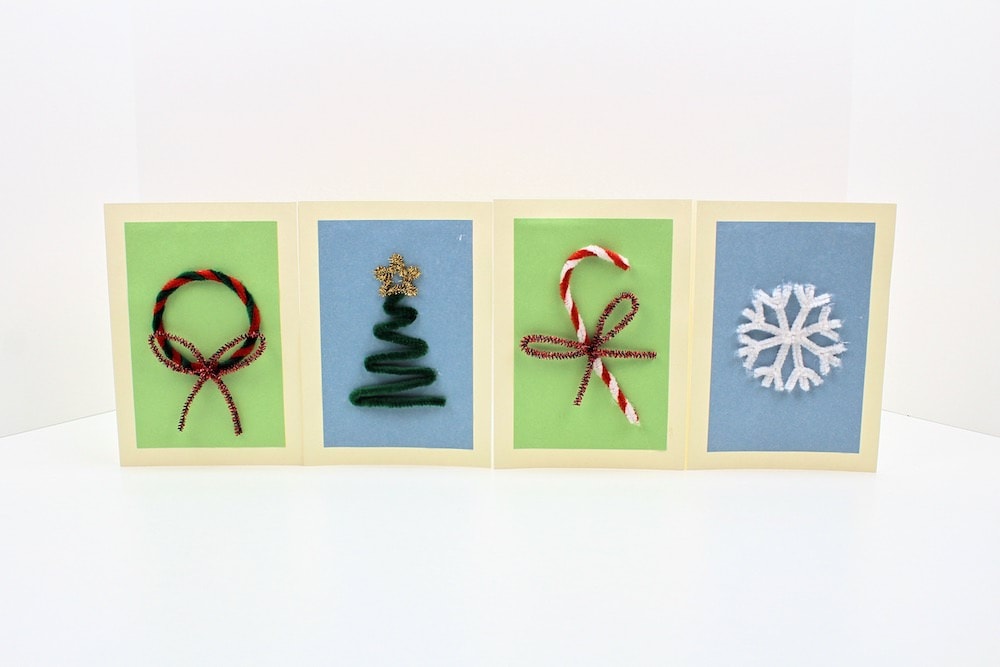 Finished pipe cleaner cards with Christmas wreath, Christmas tree, candy cane and snowflake.