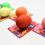 Kool-Aid dyed Easter eggs on Kool-Aid packets.