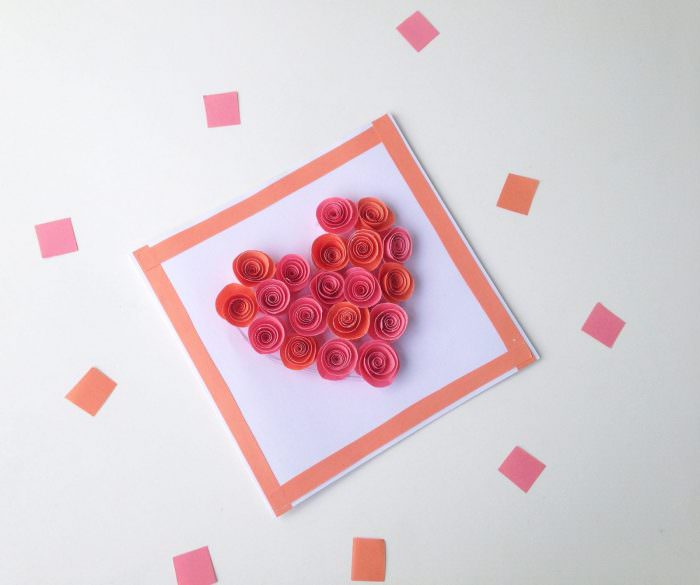 Card with heart made from paper roses.