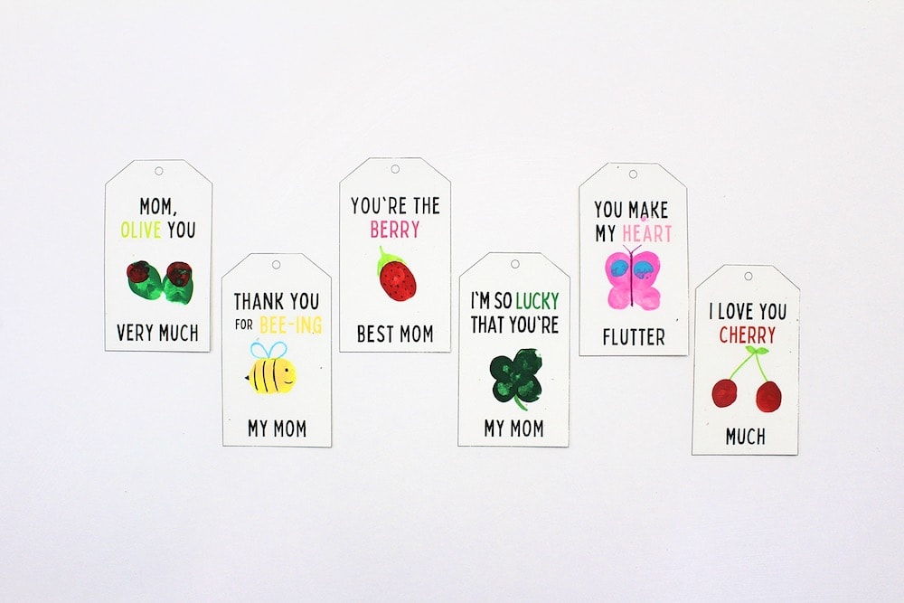 Fingerprint gift tags laid out on white background.