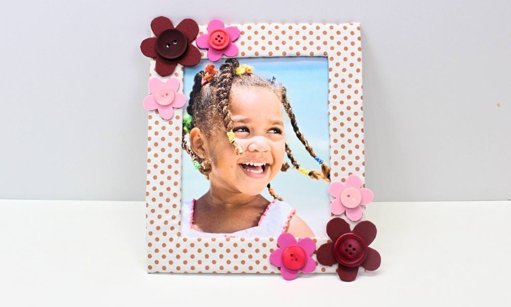 Picture frame with flower borders and little girl's photo.