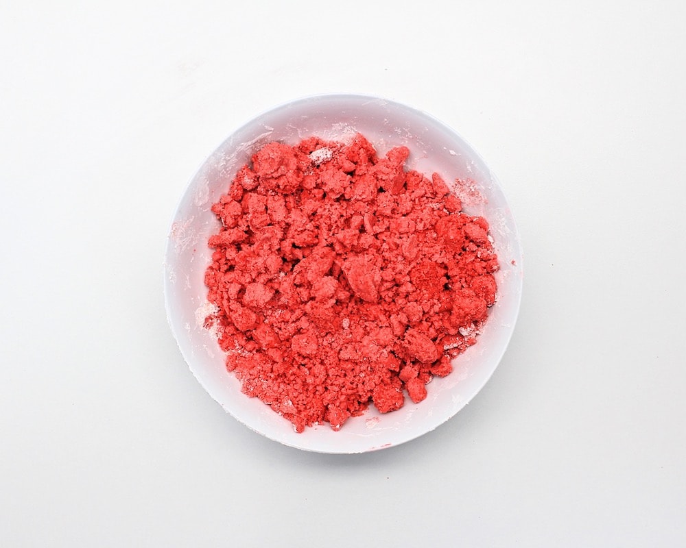 Mixture of crumbly wet cornstarch and gelatin powder in bowl