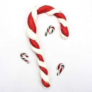 Edible candy cane slime twisted into the shape of a candy cane