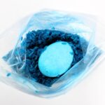 Dyed egg inside a bag of blue rice.