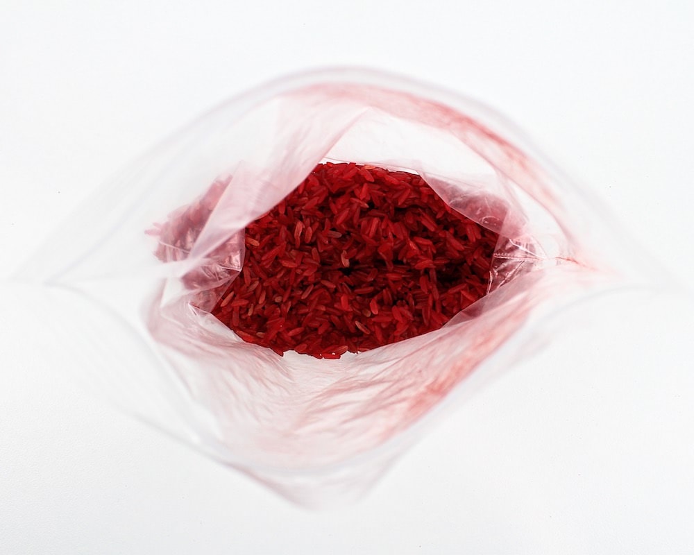 Bag of red coloured rice.