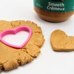 Peanut butter play dough with heart-shaped cookie cutter.