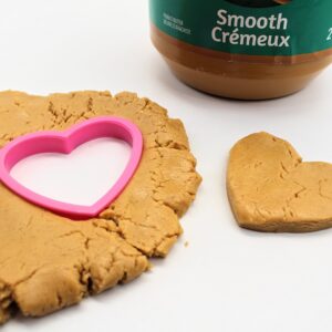 Peanut butter play dough with heart-shaped cookie cutter