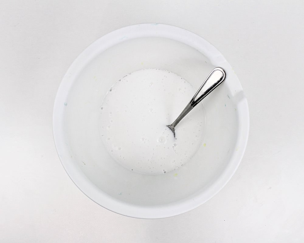 Bowl with mixed white glue and water.