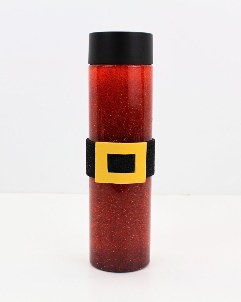 Finished red glitter bottle with Santa belt.