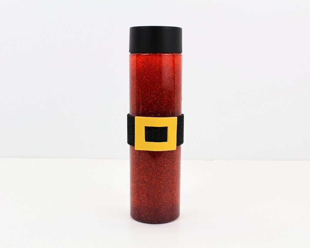 Red glitter bottle with Santa belt.