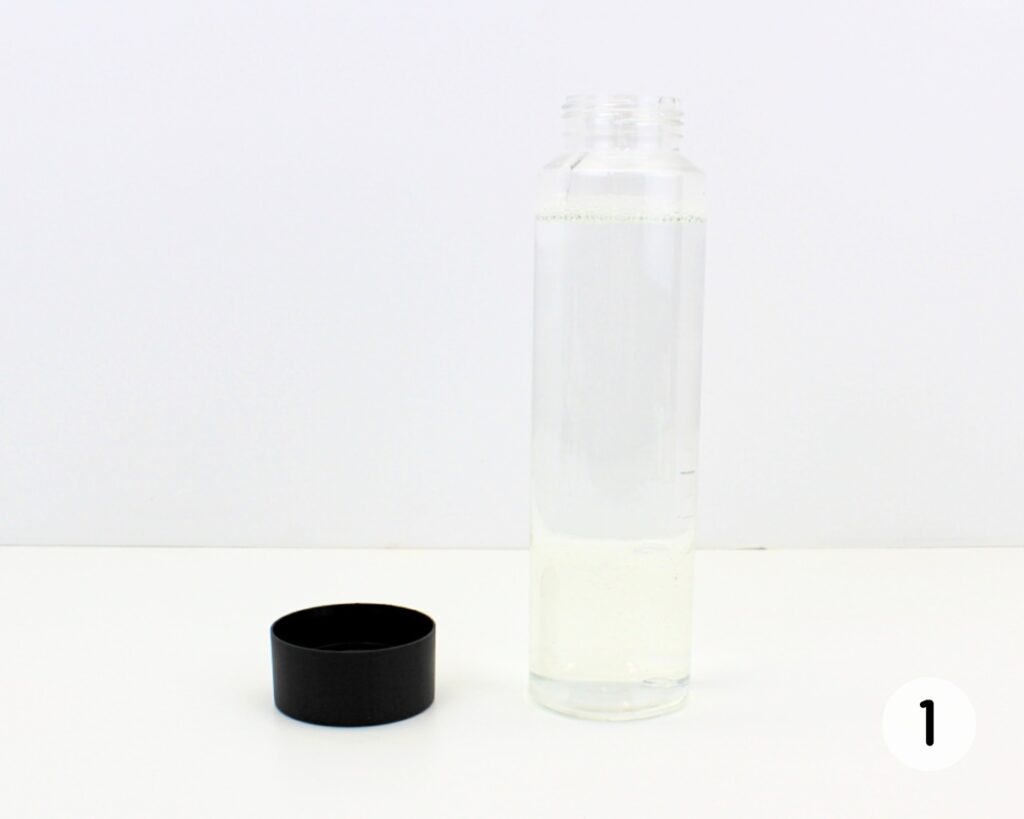 Bottle filled with clear liquid.