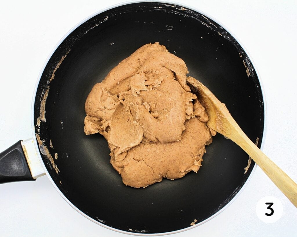 Cooked ball of play dough inside a wok.