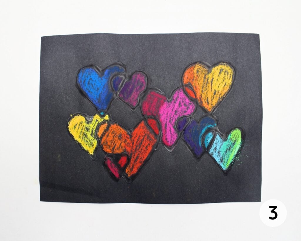 Glue hearts colored in with chalk pastel.