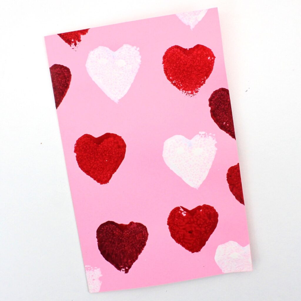 Heart-themed card stamped with a sponge cut into the shape of a heart.