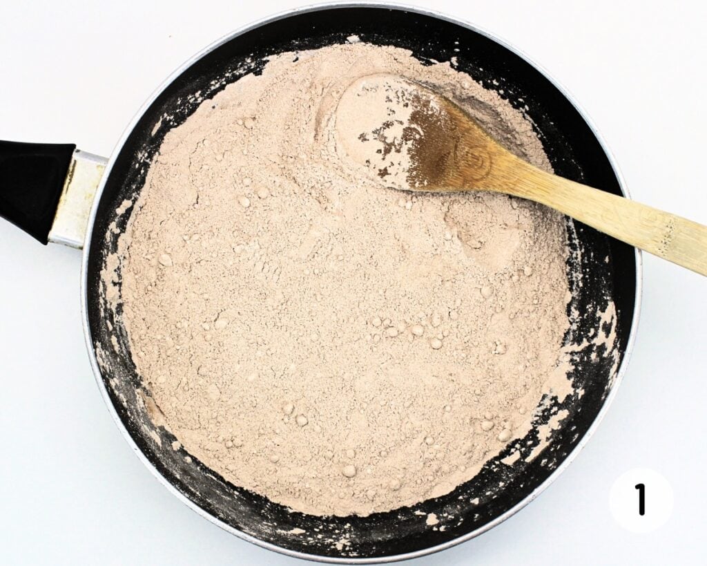 Wok with dry play dough ingredients.