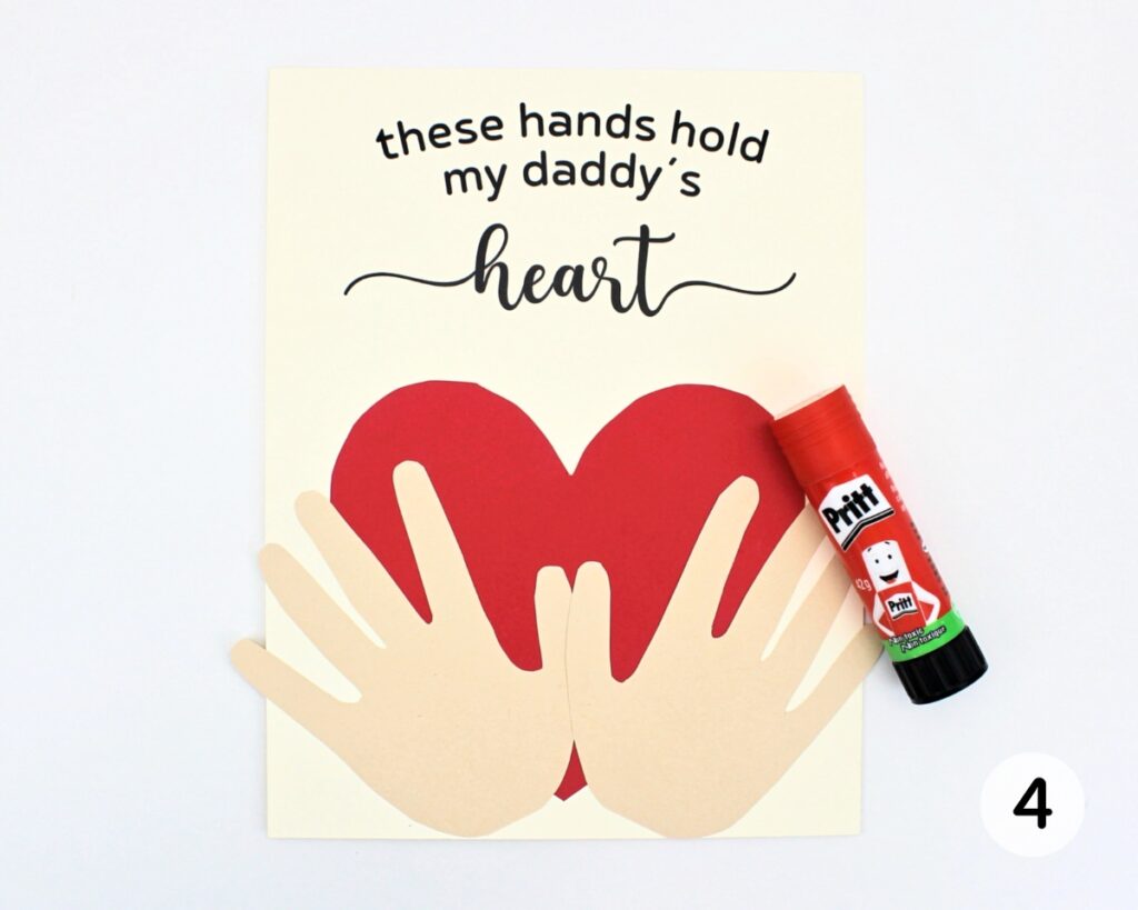 Finished Father's Day craft with hands glued on top of the heart.