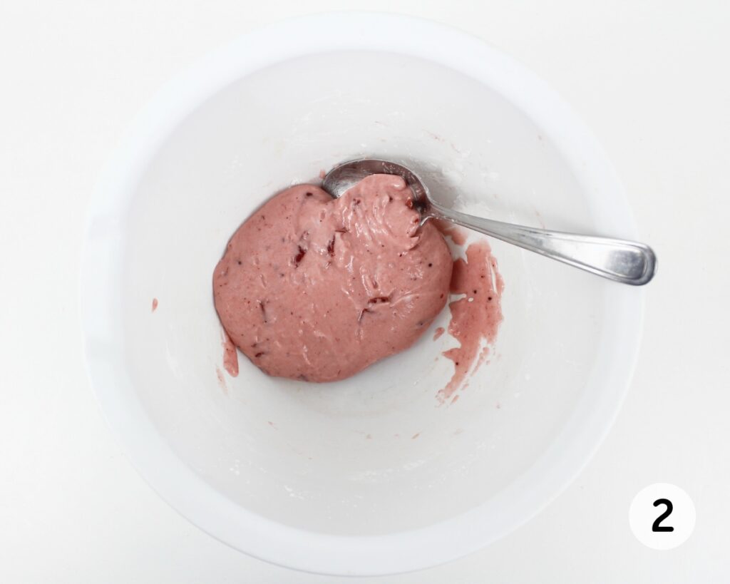 Thick pink slime in a white mixing bowl.
