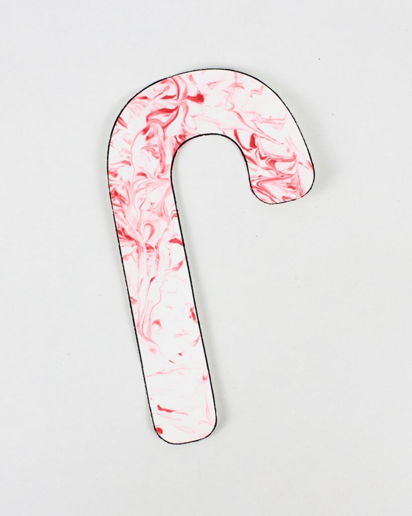 Candy cane craft with marbled patterns.