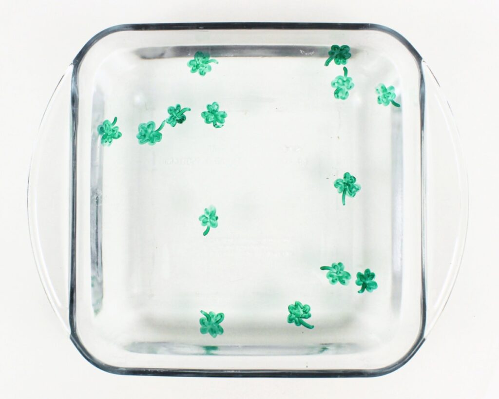 Shamrock drawings floating in water.
