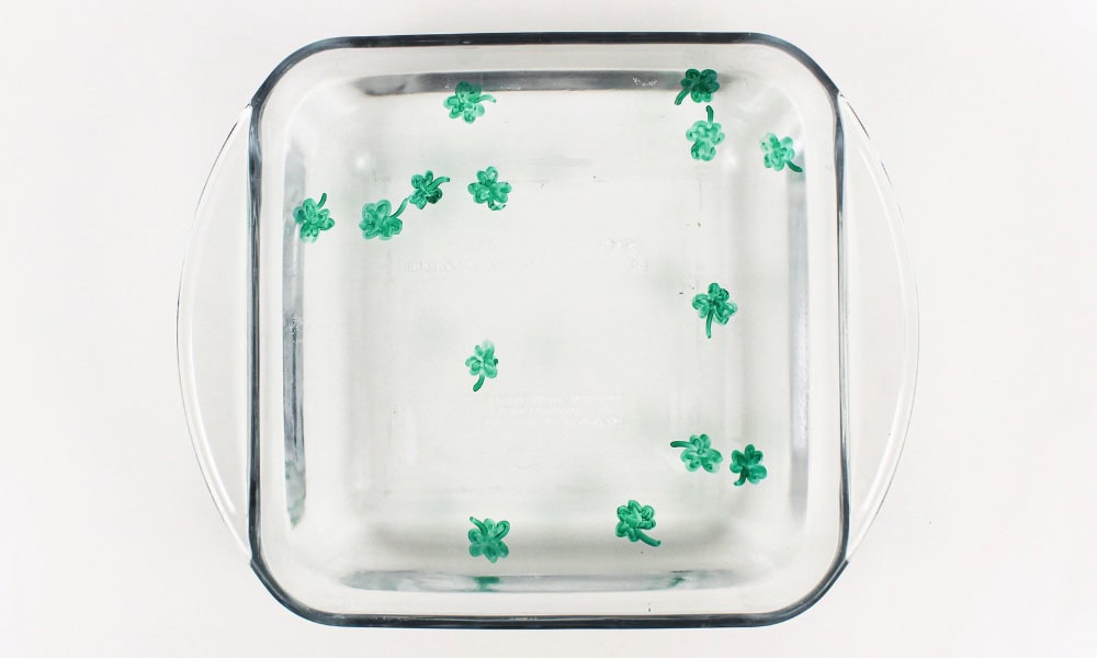 Shamrock drawings floating in water.