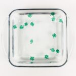 Shamrock drawings floating in water.