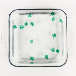 Shamrock drawings floating in water.
