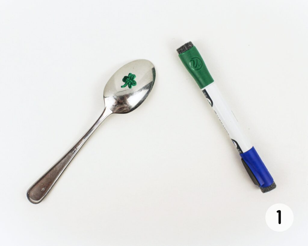 Shamrock drawing on the back of a spoon.