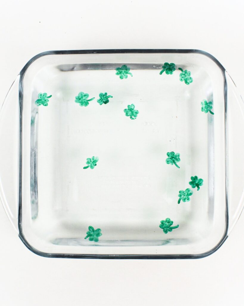 Shamrock drawings floating in water.