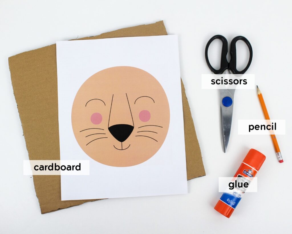 Supplies needed to make a lion-themed dandelion threading craft.