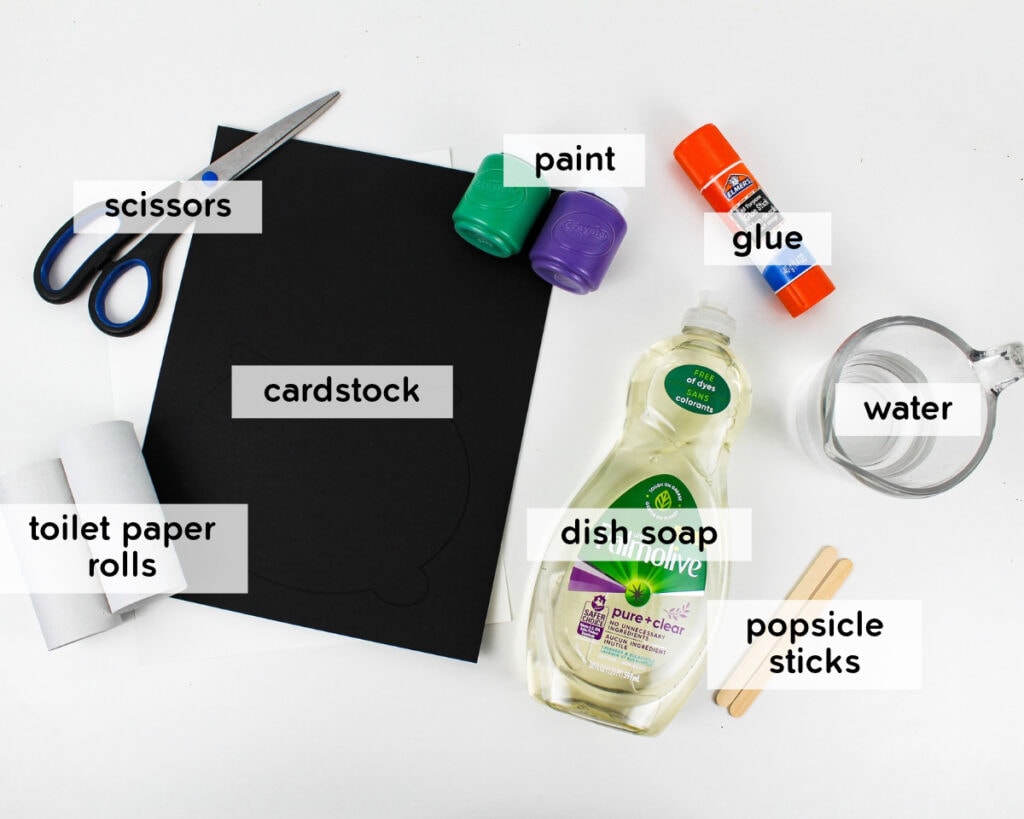 Supplies needed to make a bubbling paper roll stamped cauldron craft.